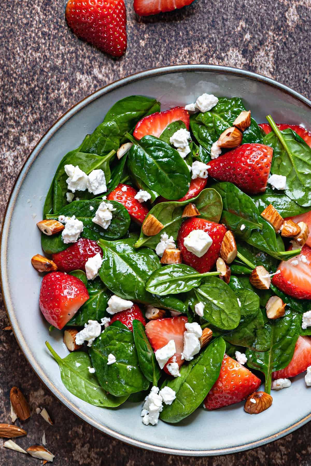 close up view of fresh strawberry spinach salad
