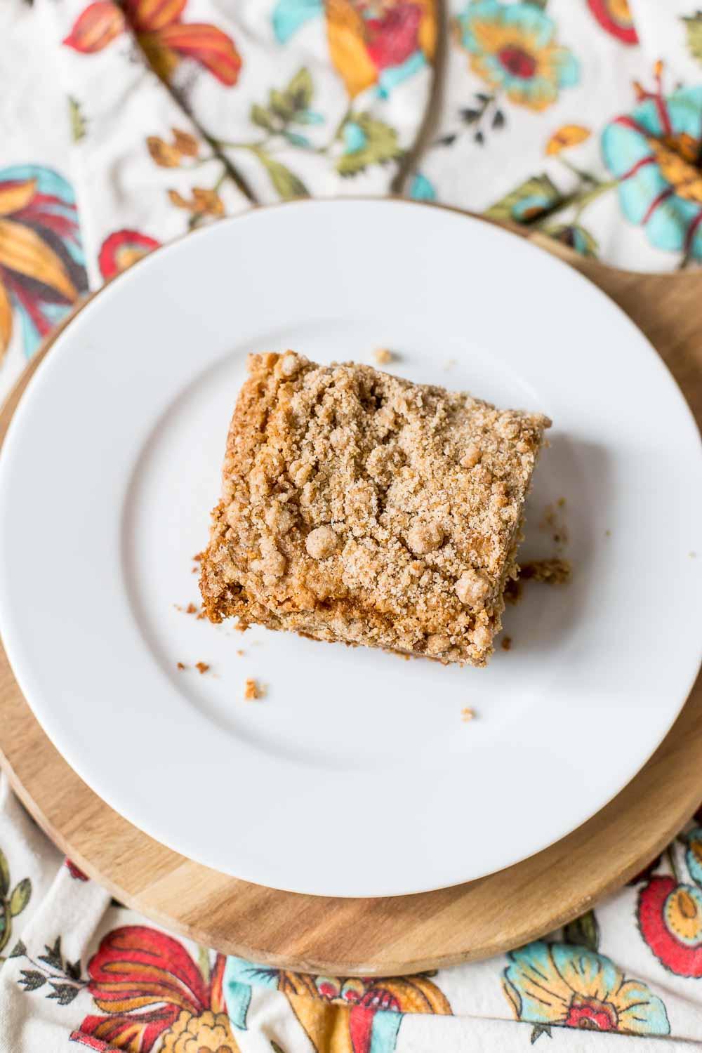 Slices of coffee cake with chai latte glaze and crumb topping on a plate