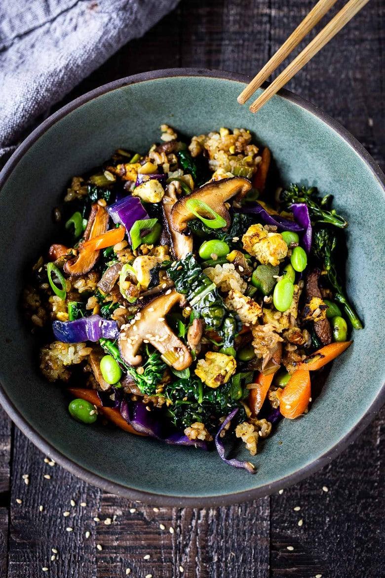 vibrant grilled vegetable fried rice in a wok, with colorful grilled vegetables and steam rising