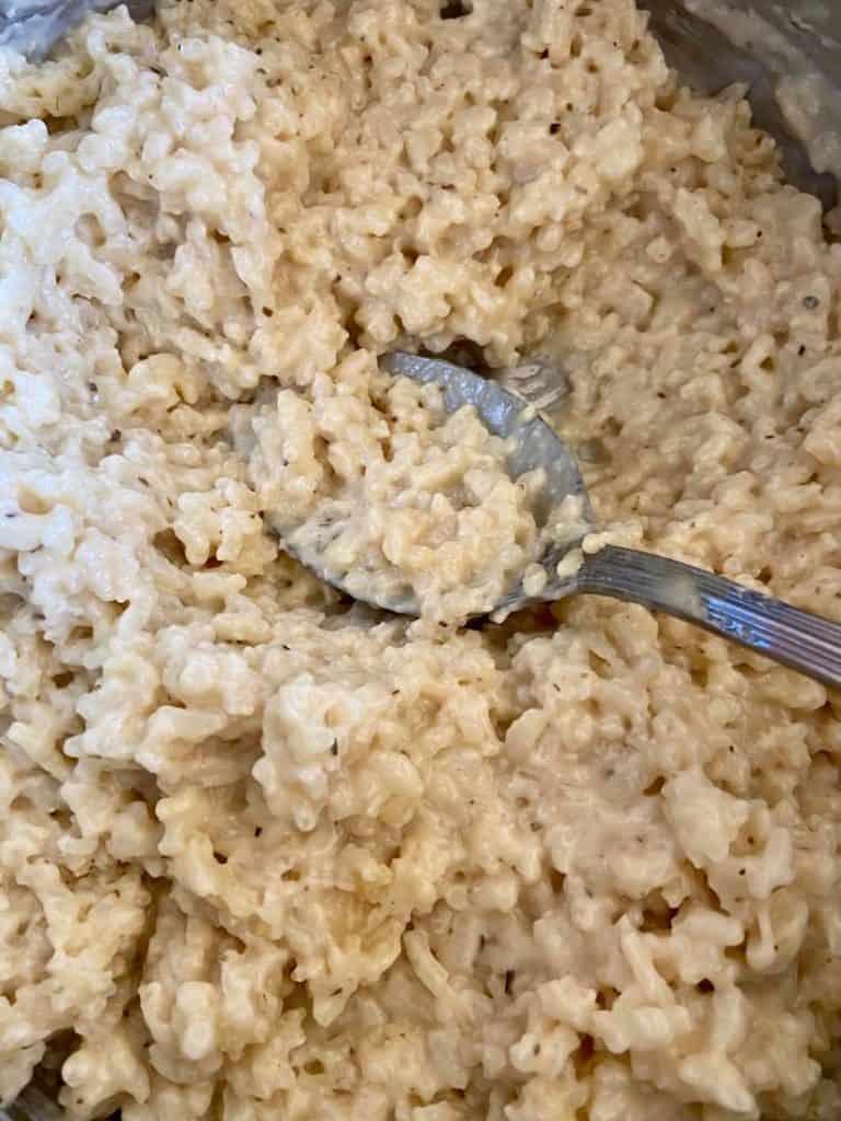 close up view of a creamy rosemary garlic risotto in a bowl