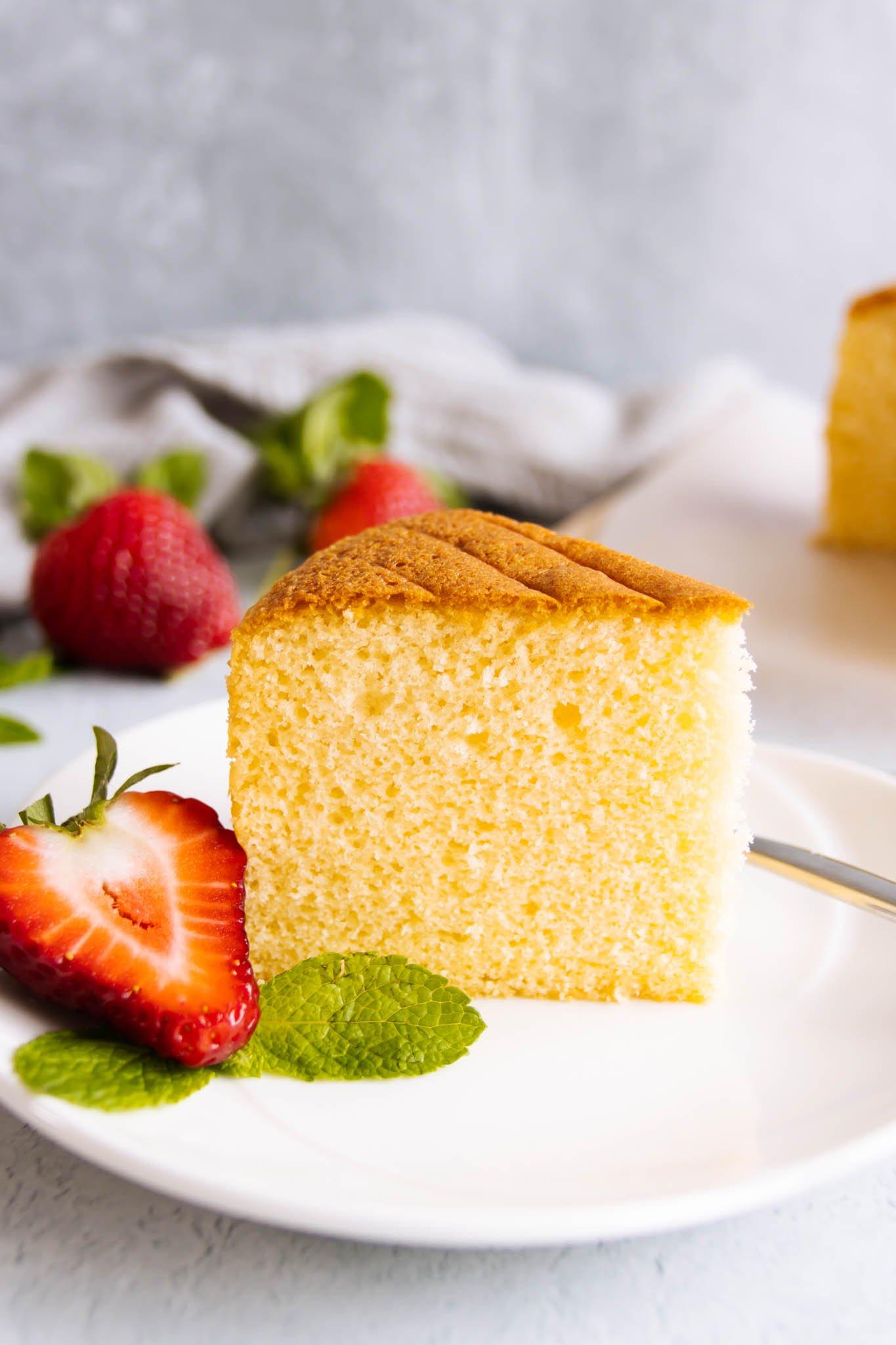 Close-up of a slice of sponge cake showing its light and airy texture