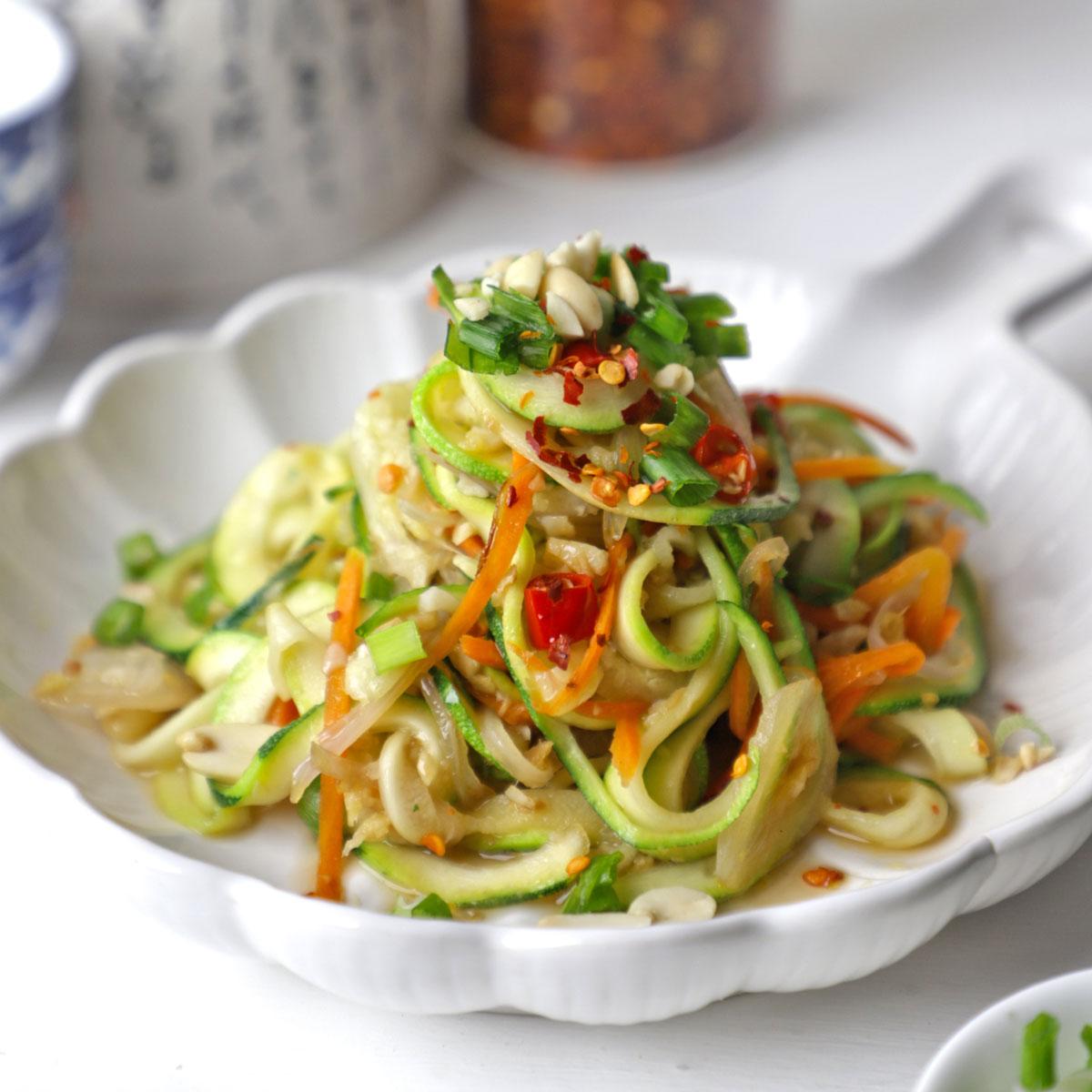 Close-up shot of lentil soup zoodle stir-fry in a skillet