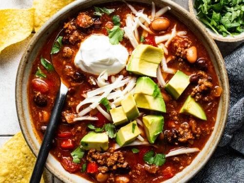 bowl of sweet corn and chorizo chili topped with cilantro