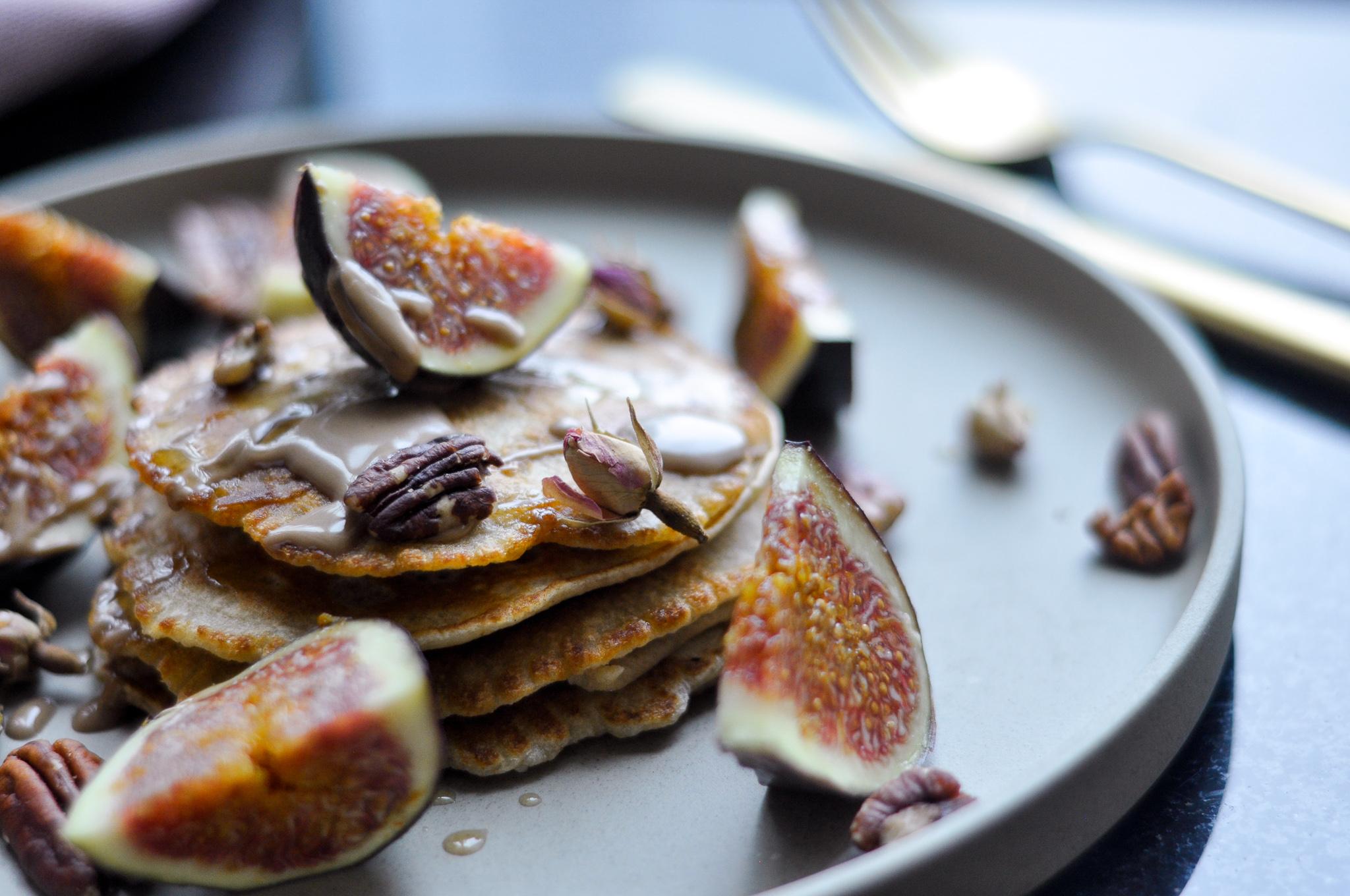 close up of gluten-free fig balsamic pancakes being drizzled with balsamic glaze