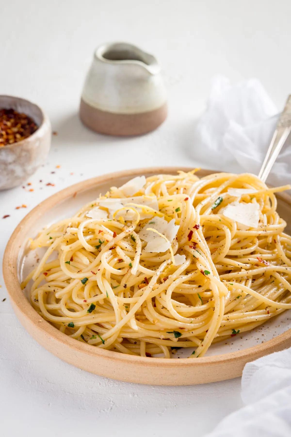 Spaghetti Aglio e Olio with Chili Flakes served in a white bowl