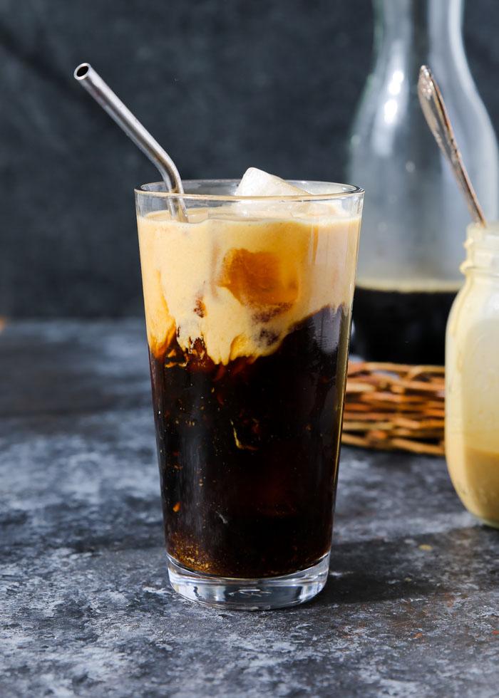 A glass of Pumpkin Cream Cold Brew Chiller with ice