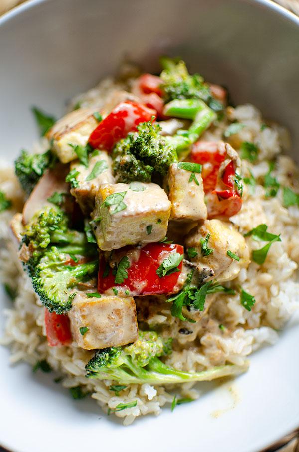 Close-up shot of spicy peanut tofu stir-fry with rice.