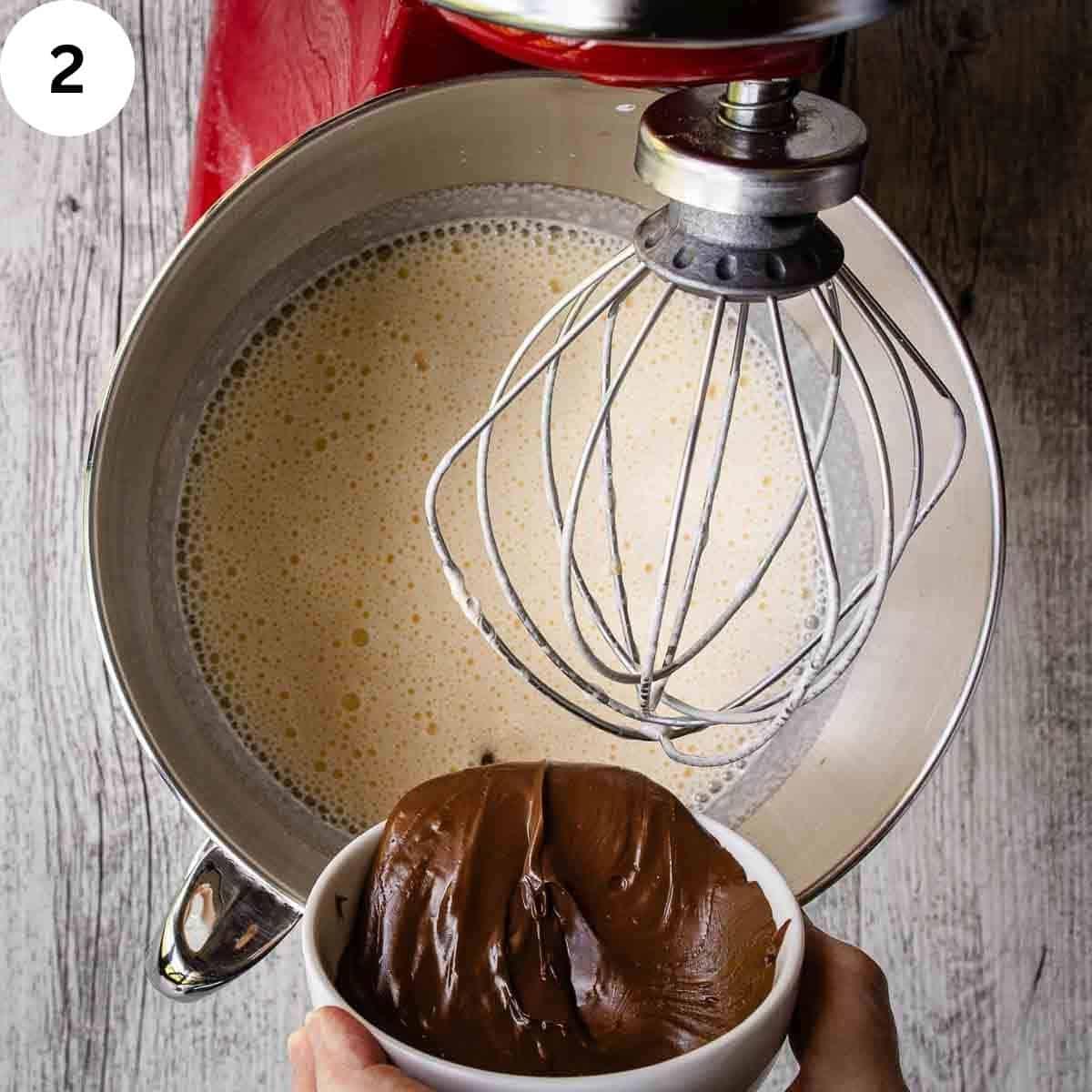 A person mixing ingredients for nutella cake in a large bowl