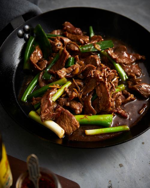 sizzling beef stir-fry in a wok