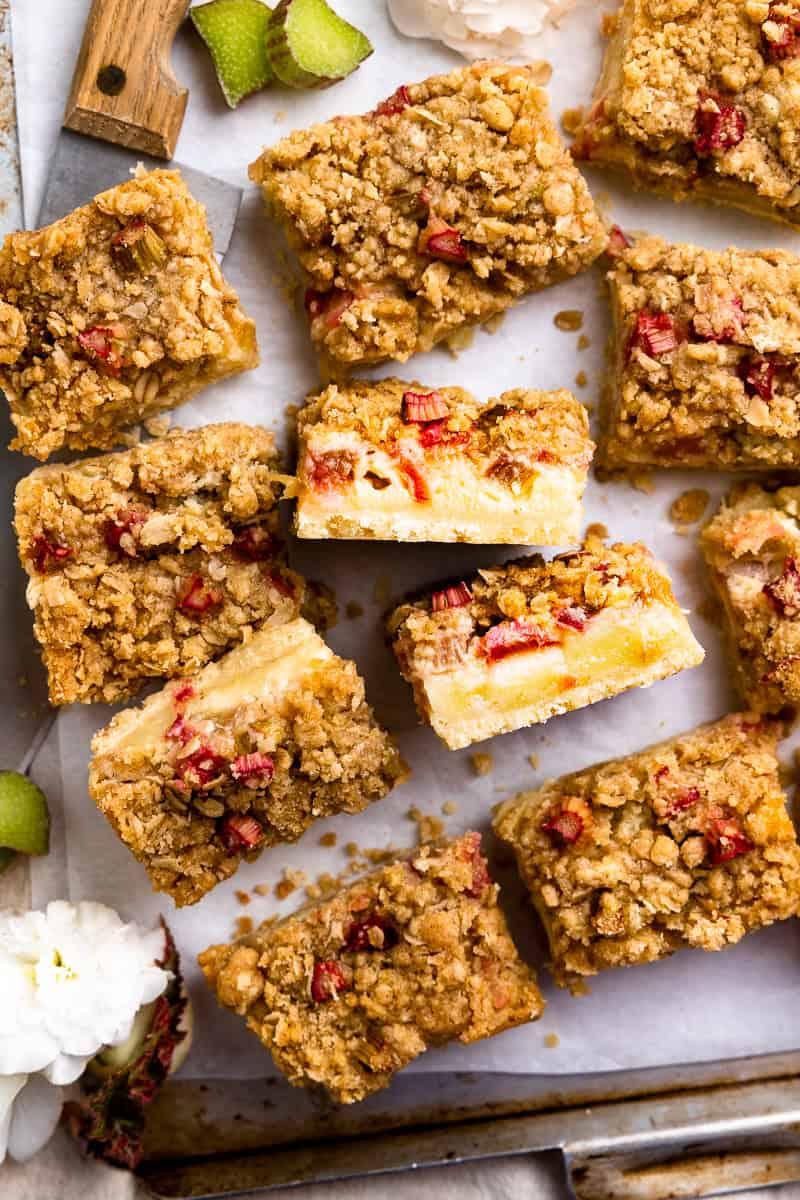 cinnamon rhubarb crumb bars on a rustic wooden surface