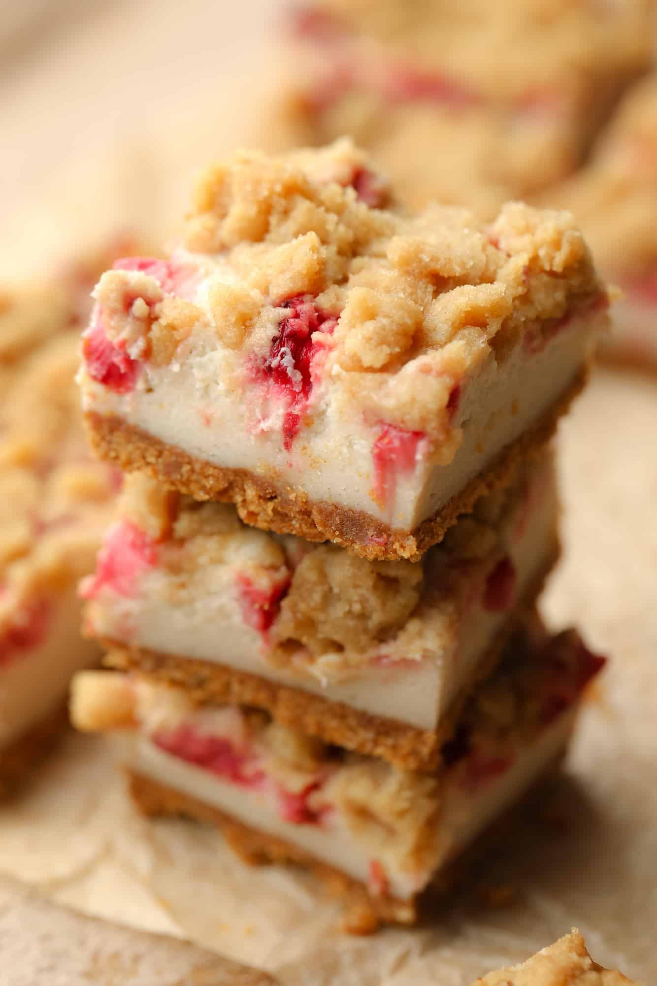 close up of a slice of vegan strawberry cheesecake bar