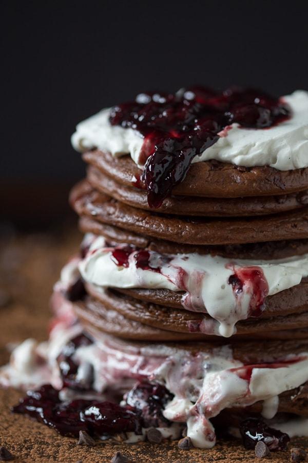 stack of Black Forest gluten-free pancakes with cherries and chocolate shavings