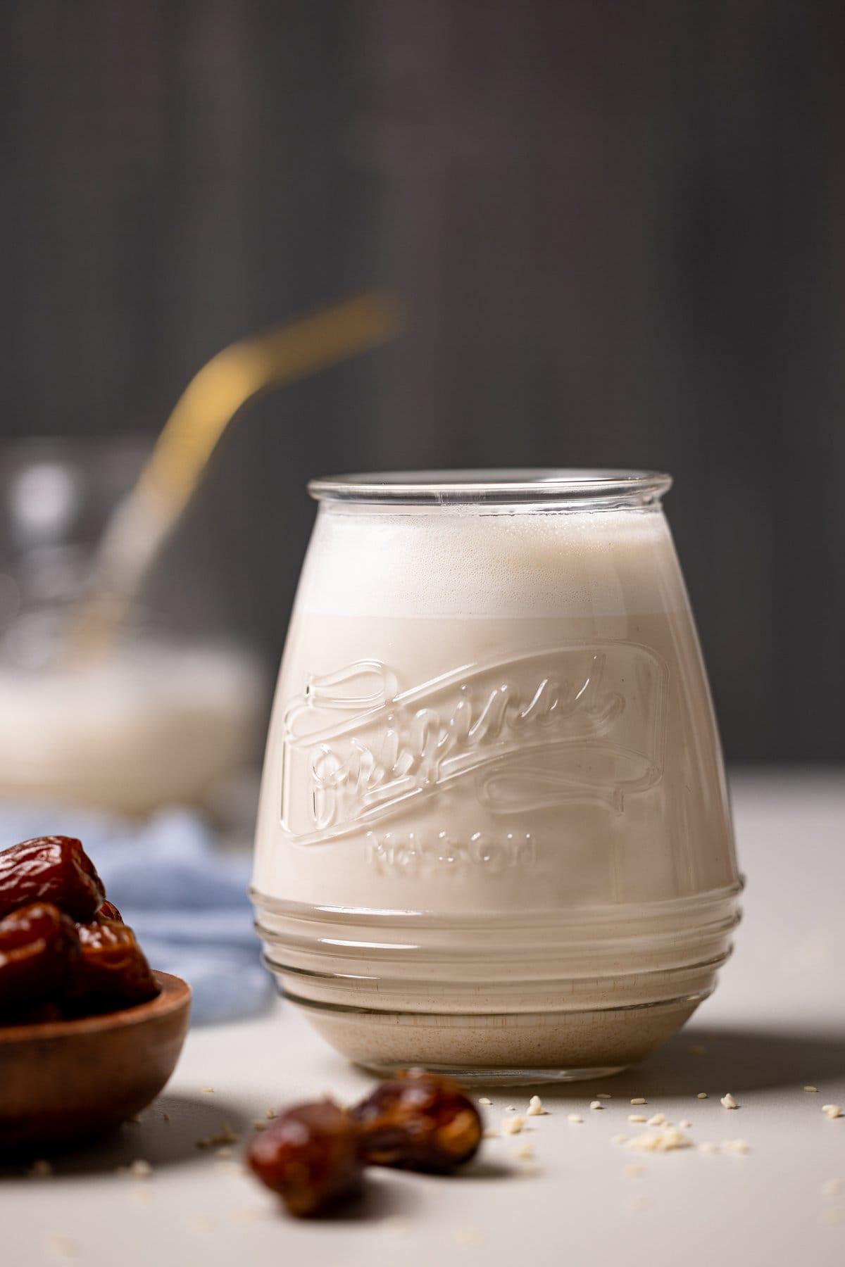 creamy sesame seed milk with vanilla and protein powder in a glass