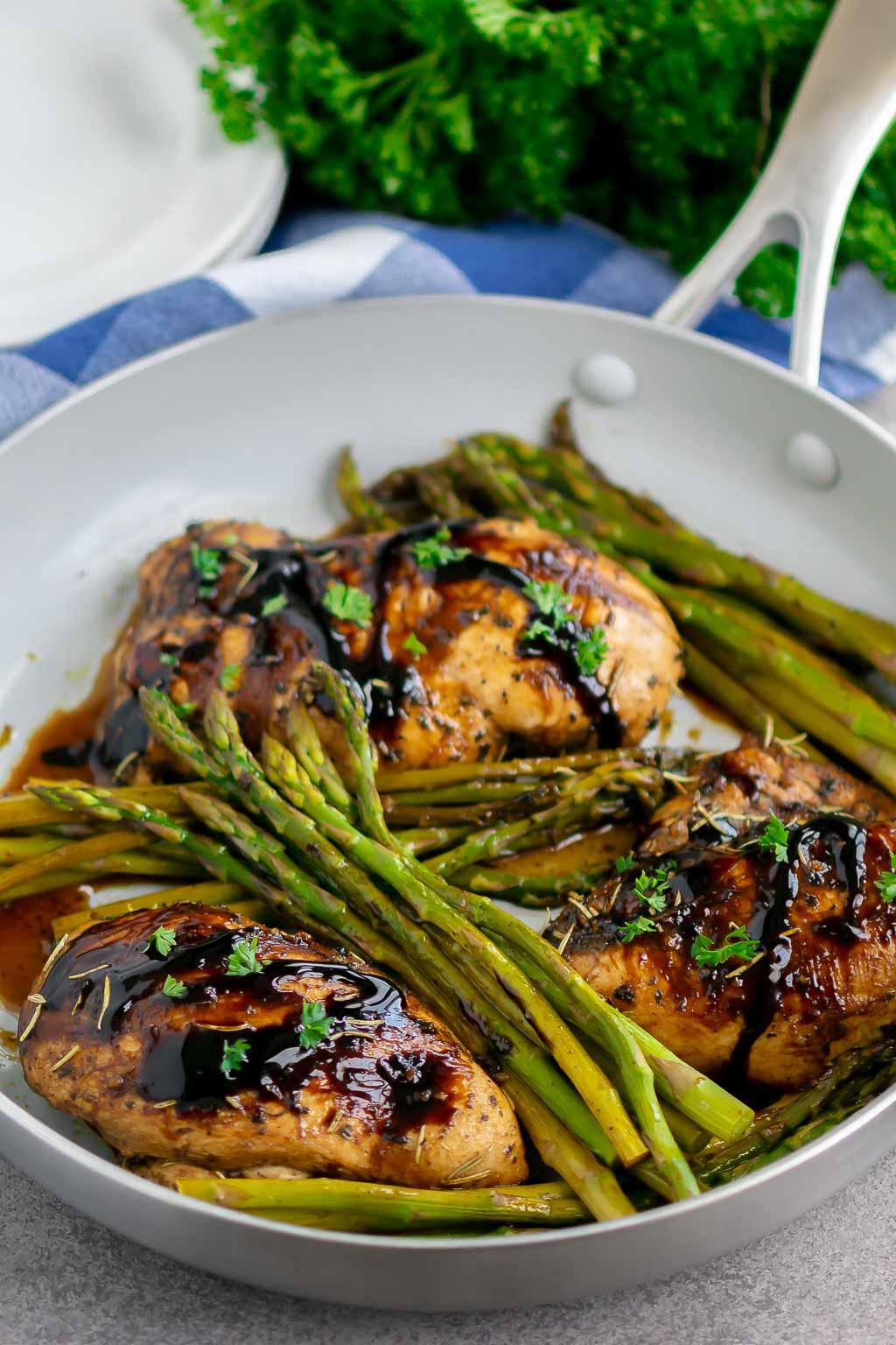 Balsamic glaze drizzled over stir-fried chicken and asparagus