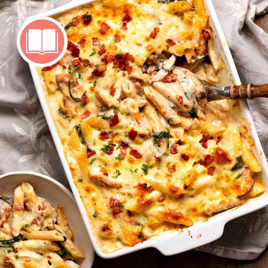 Close up of Creamy Tuscan Chicken Pasta Bake showing creamy sauce and chicken