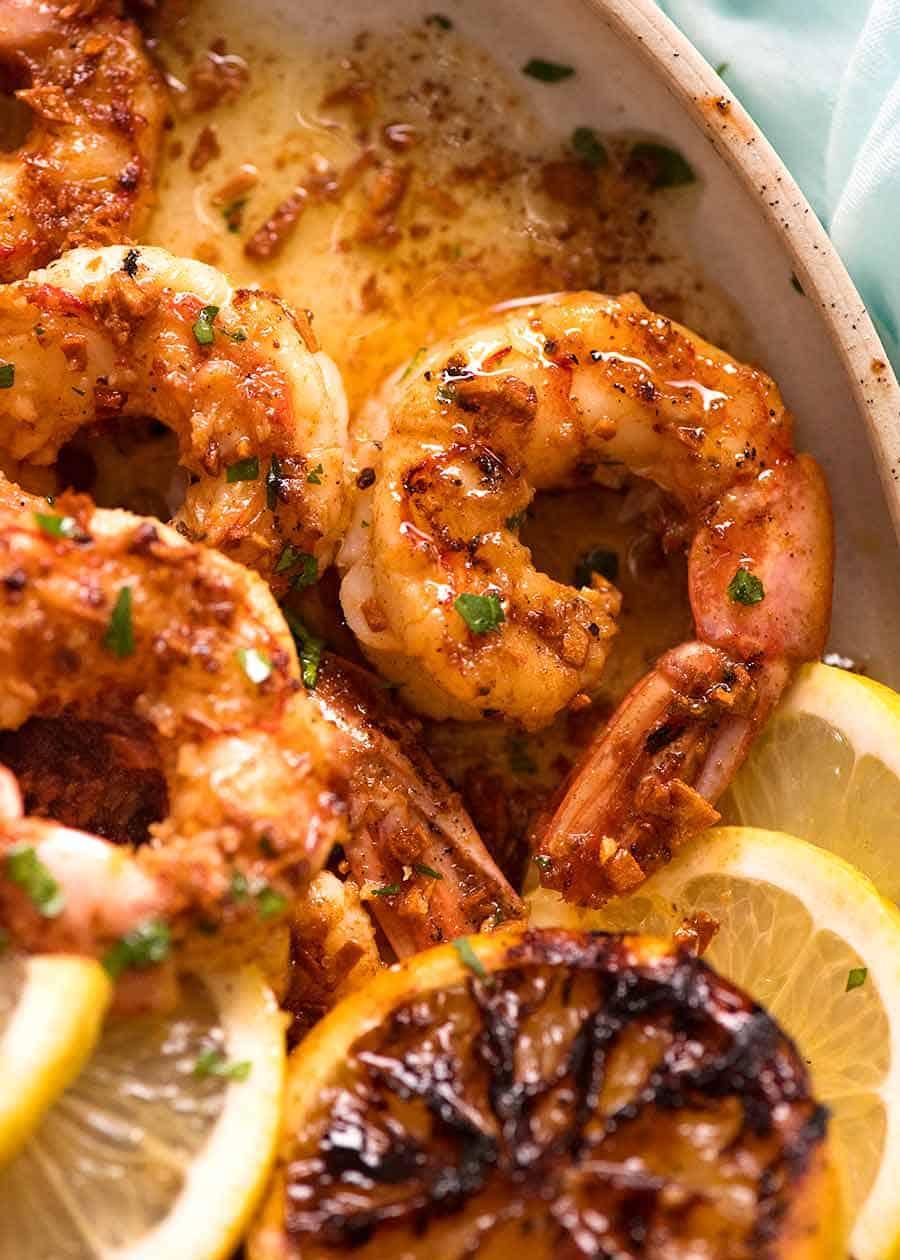close-up of grilled shrimp with garlic butter sauce