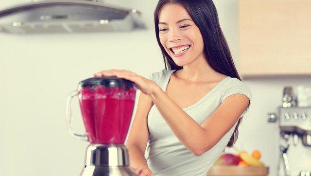 a person blending a smoothie