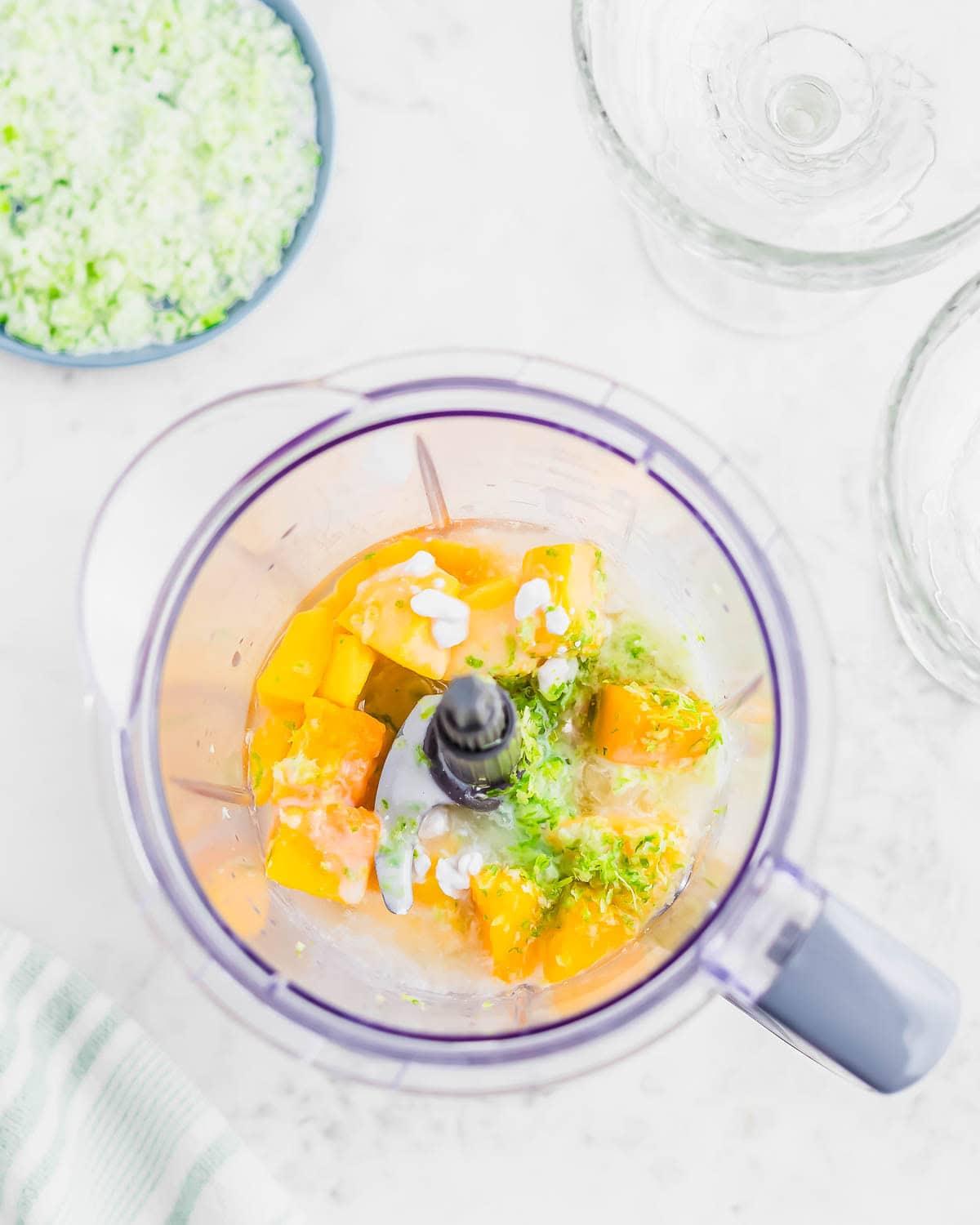overhead shot of the ingredients for coconut mango mirage arranged on a table