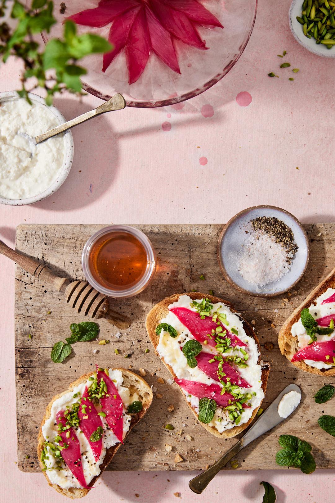 Rhubarb Ricotta Bread Sliced on a Wooden Board