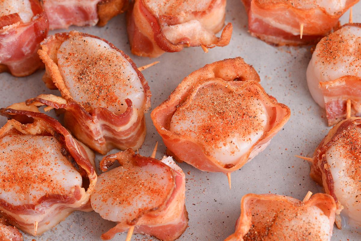 close-up shot of bacon-wrapped scallops being prepared