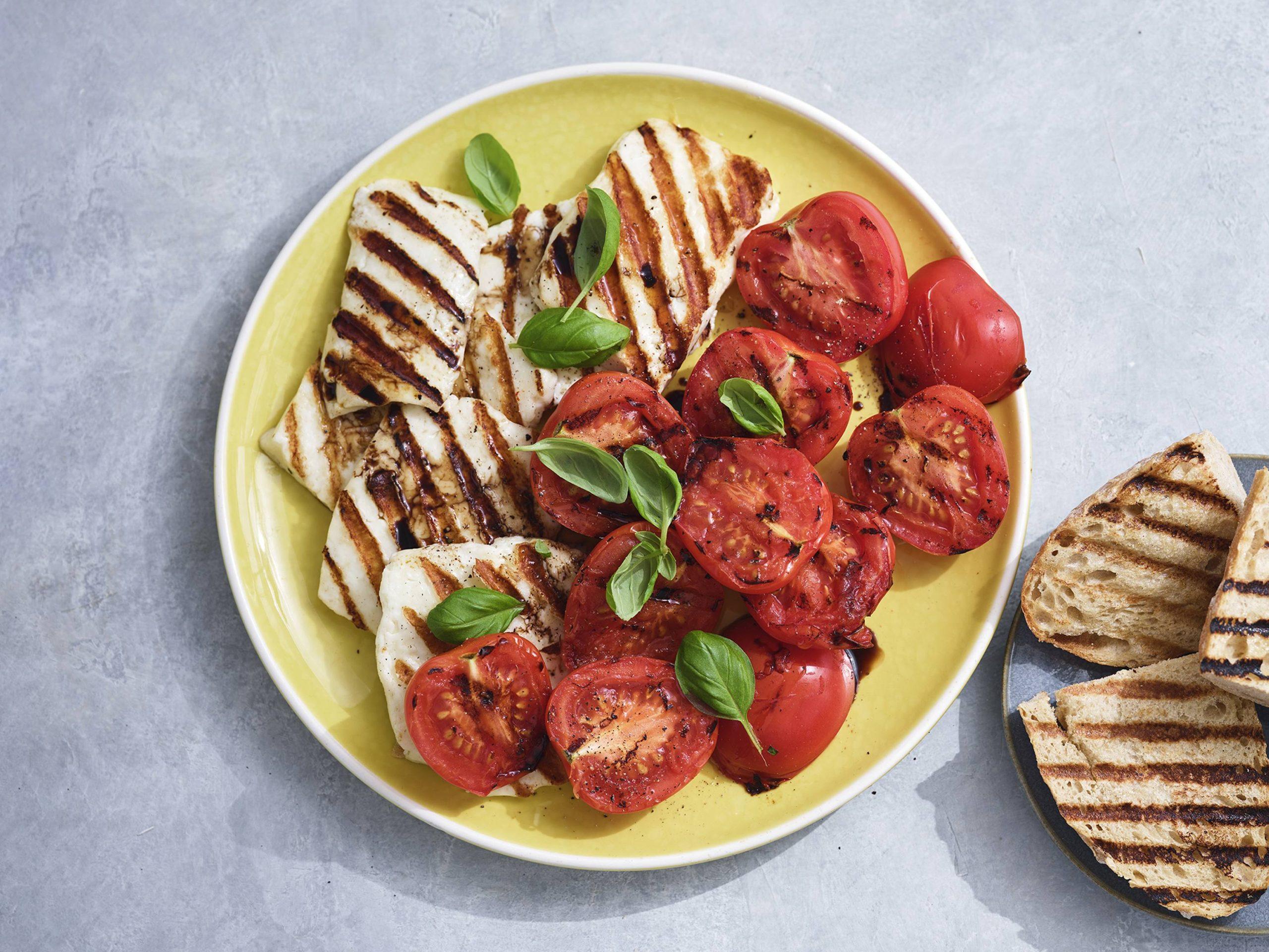 caprese salad with grilled halloumi, vibrant and fresh