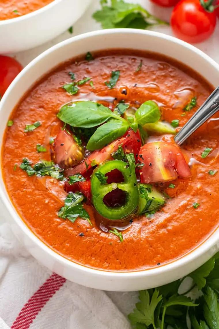 bowl of tomato gazpacho with cucumber and bell pepper