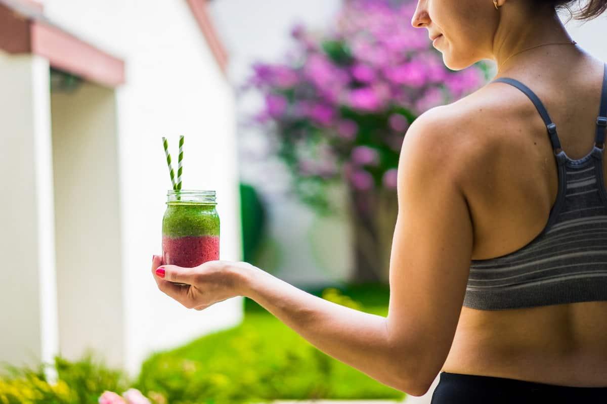 someone enjoying the smoothie after a workout at the gym