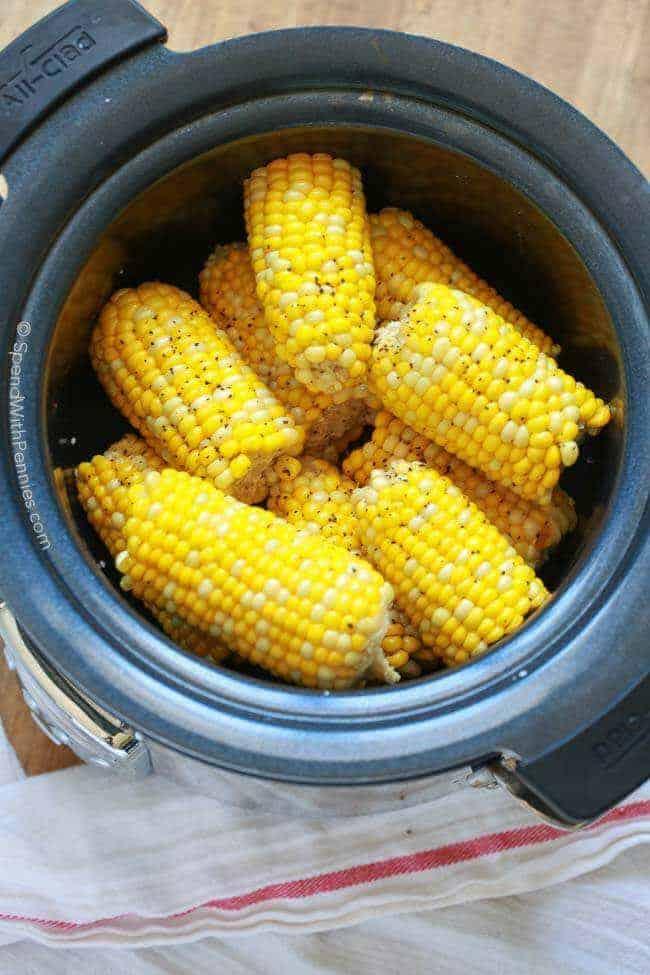 Crockpot filled with cooked corn on the cob