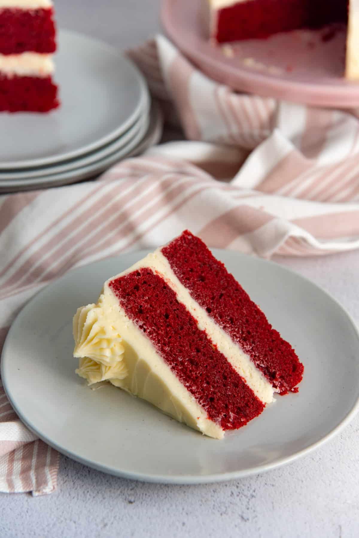 close-up of a red velvet cake with cream cheese frosting, showing the cake's texture