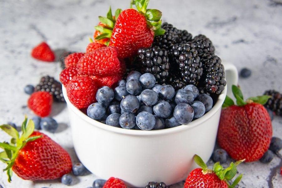 assorted fresh summer berries in a bowl