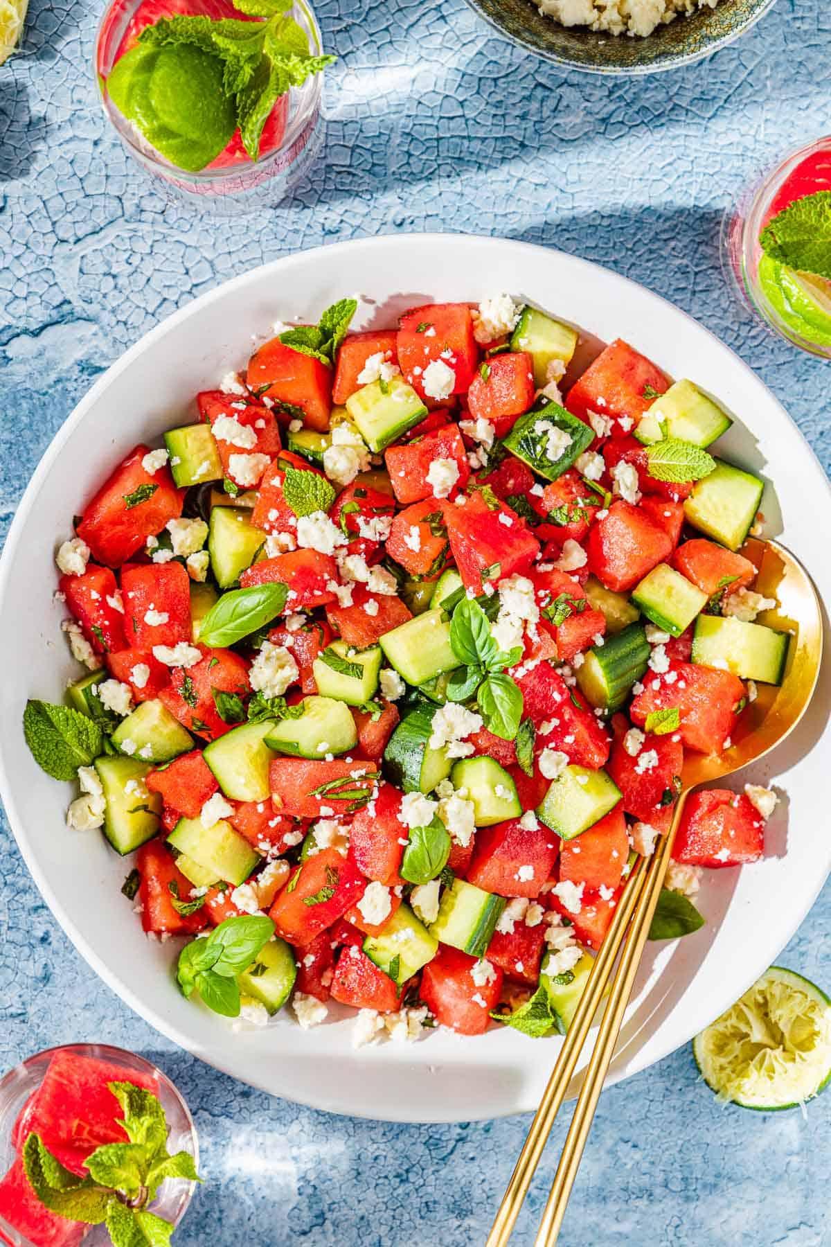 A vibrant Watermelon Feta Salad with Mint, served on a bright, sunny day, showcasing its fresh and colorful ingredients