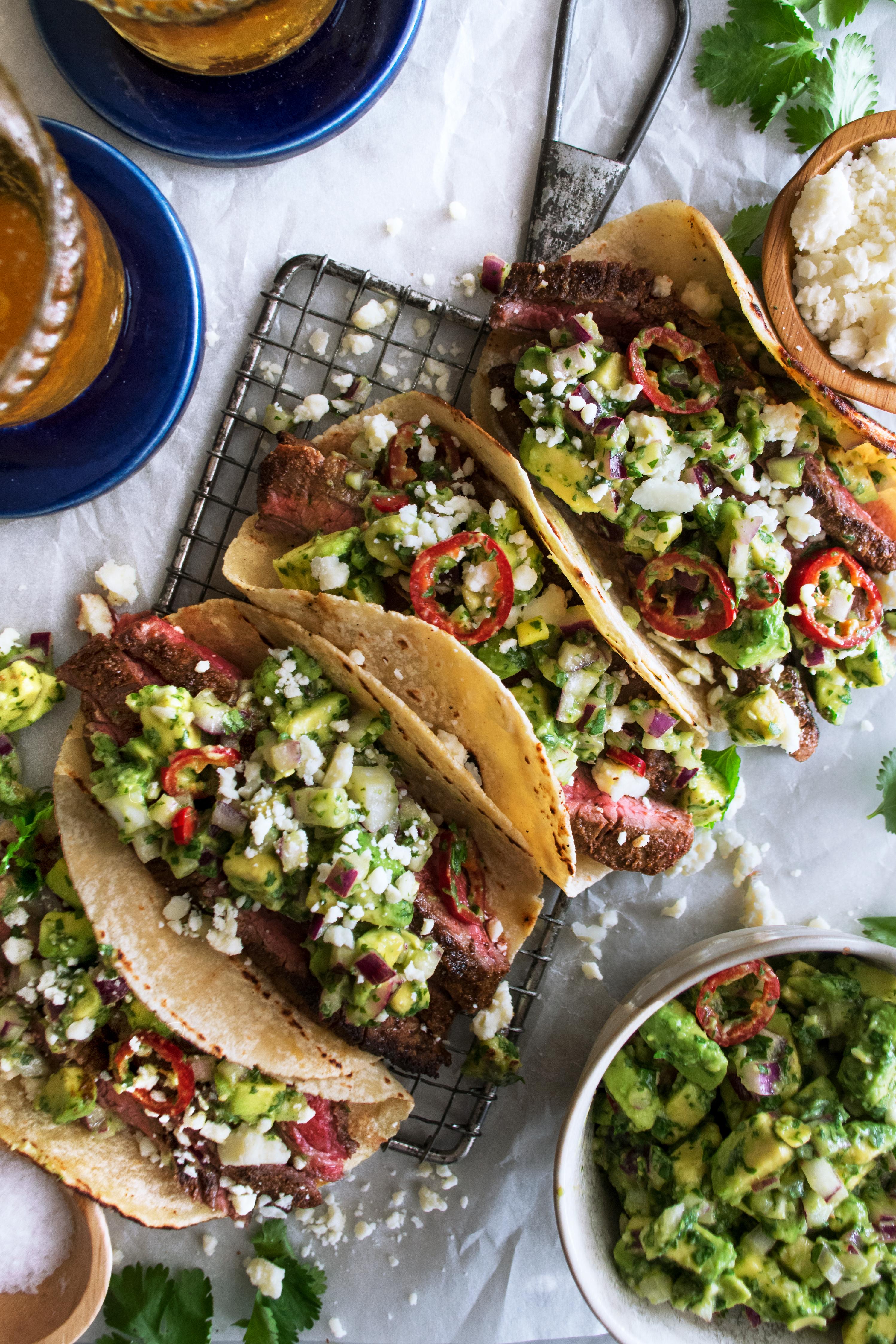 Steak taco assembly with various toppings