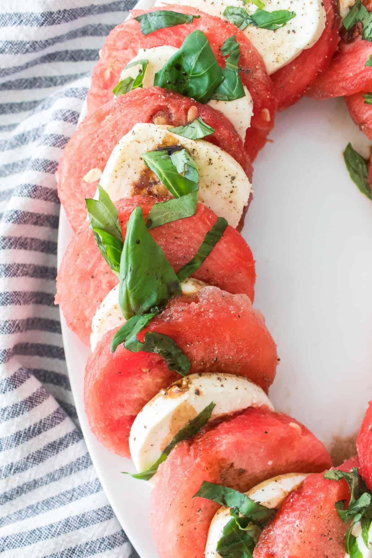 close up watermelon basil mozzarella salad