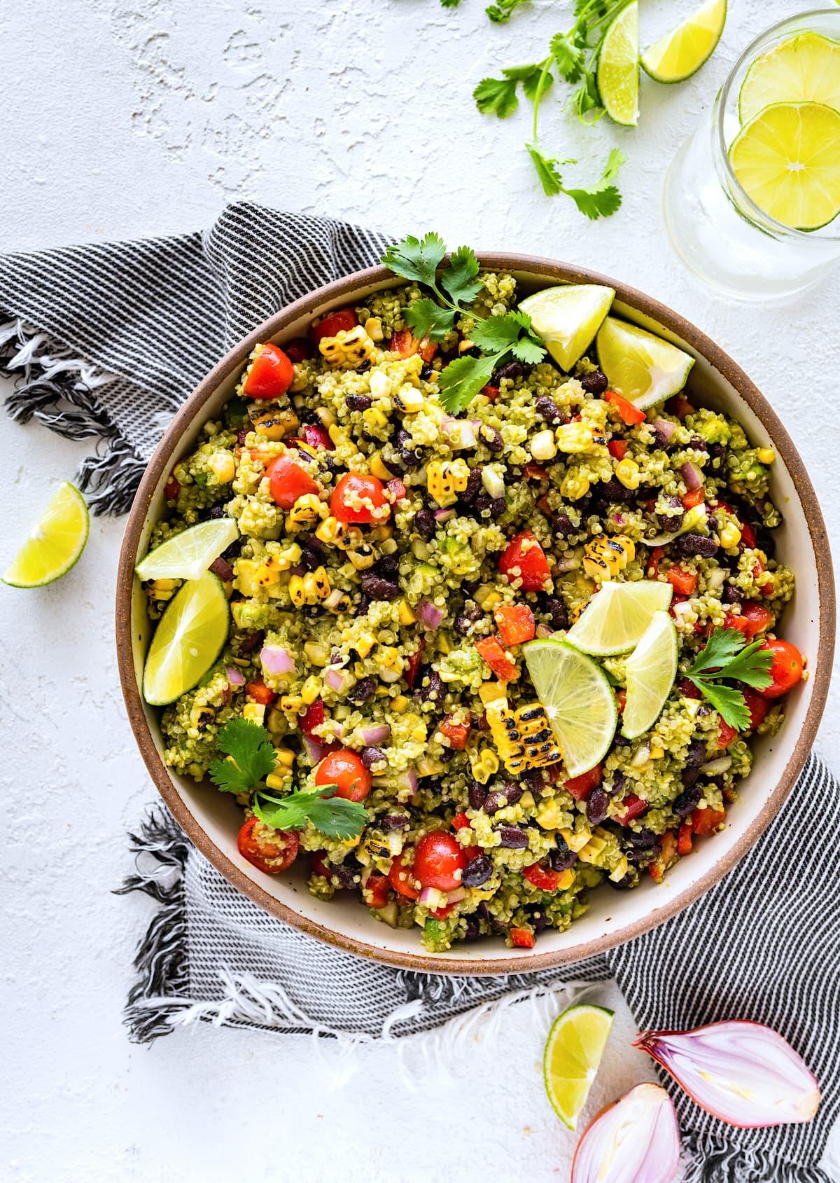 southwest quinoa bowl being assembled