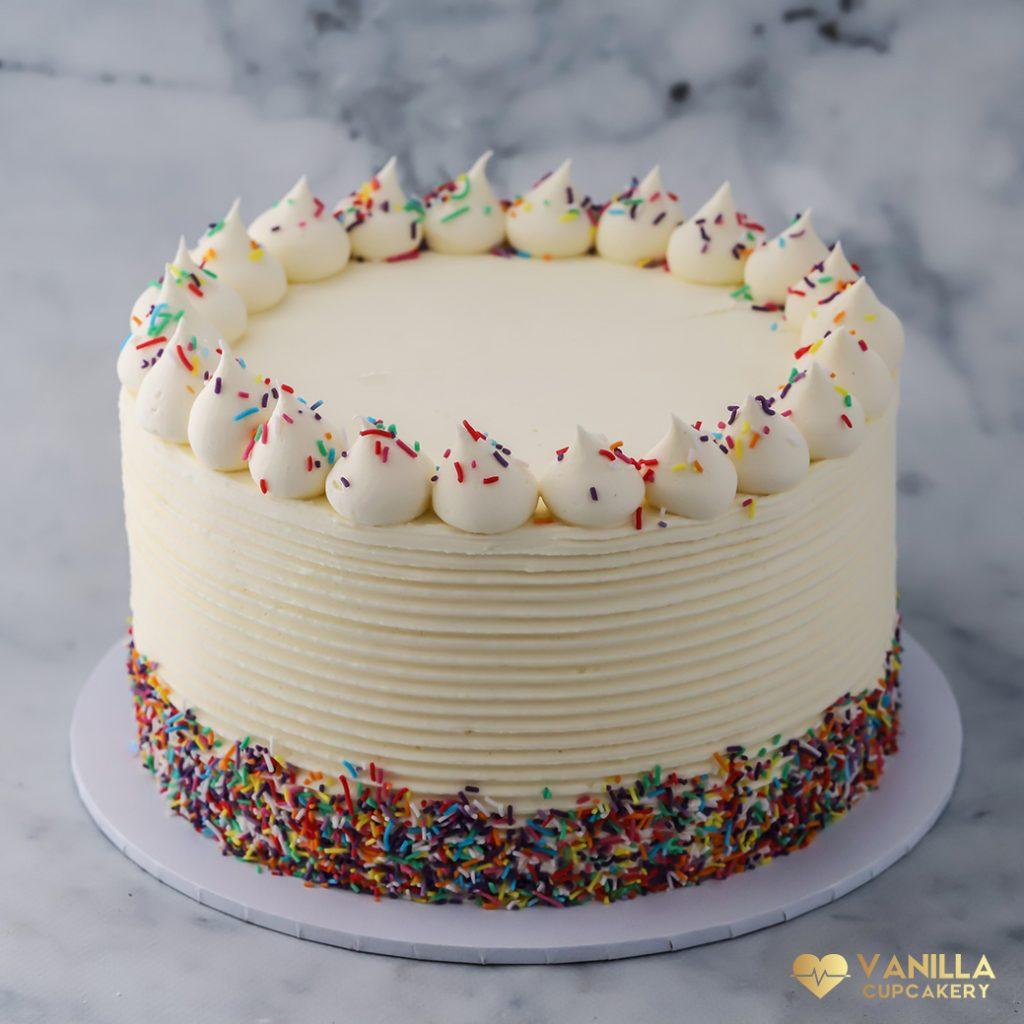 vanilla birthday cake with shimmering sprinkles