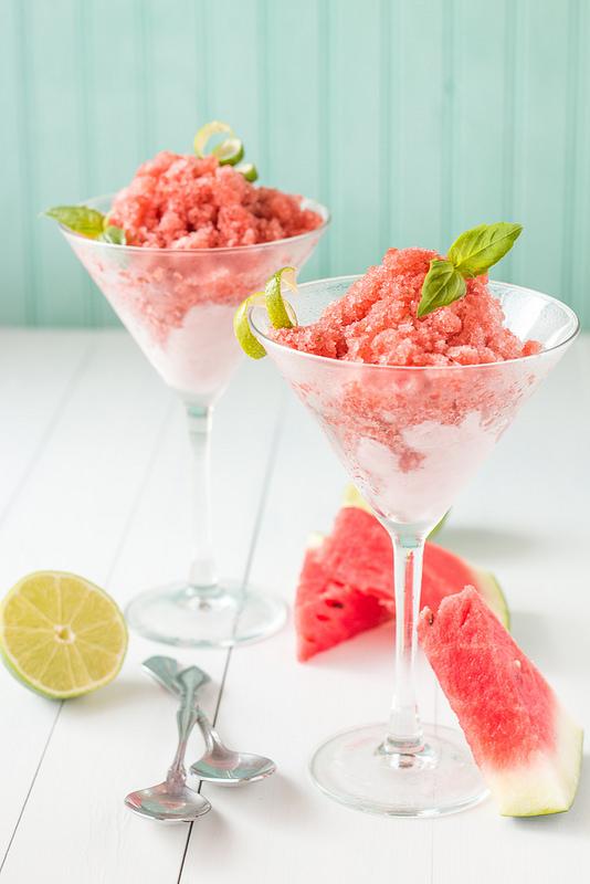 Watermelon basil granita in a glass dish, garnished with fresh basil