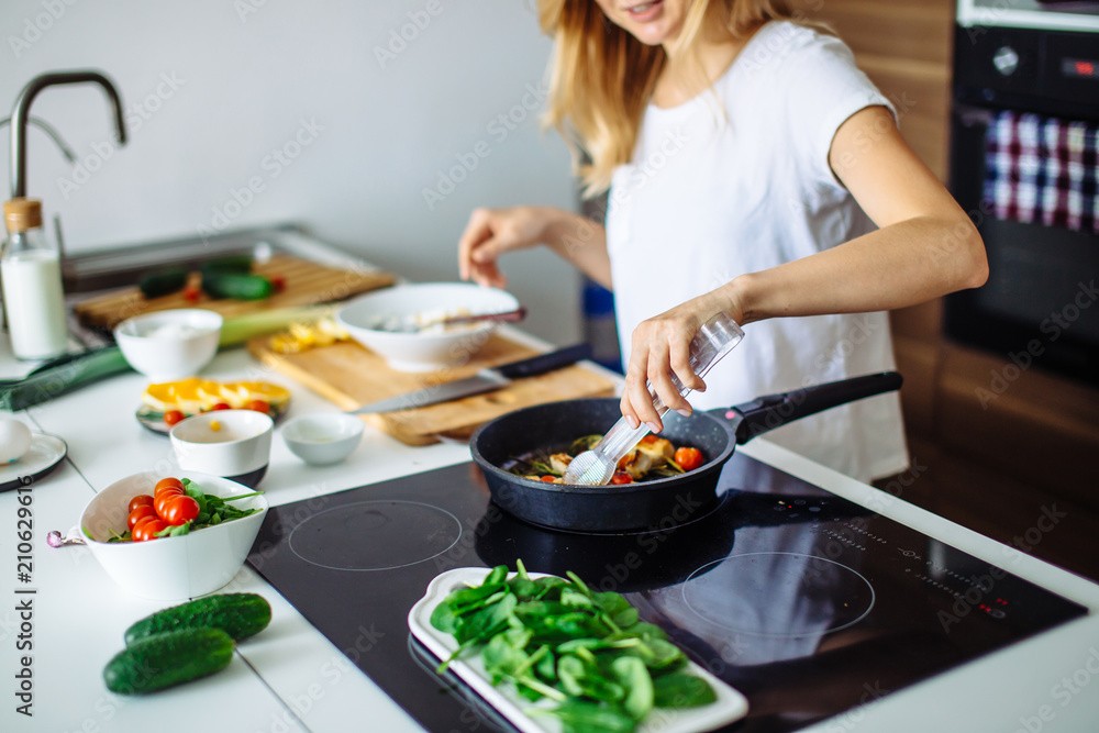 woman preparing healthy dinner in kitchen