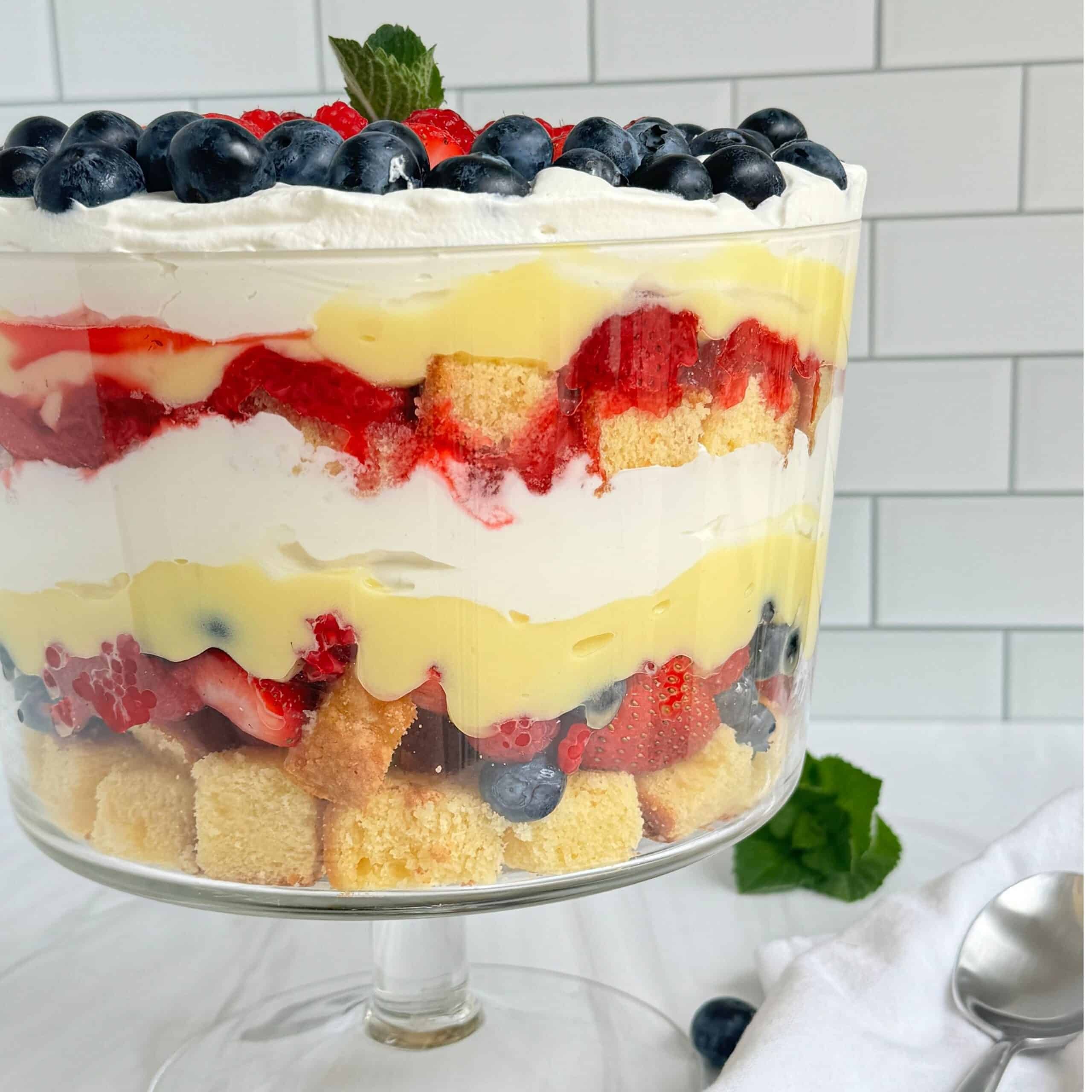 Patriotic berry trifle jars with fresh berries and whipped cream