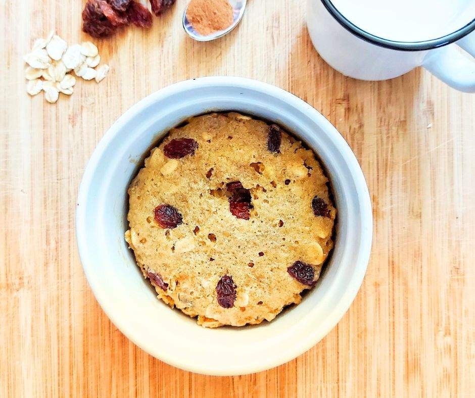 oatmeal raisin cookie mug cake in a white mug