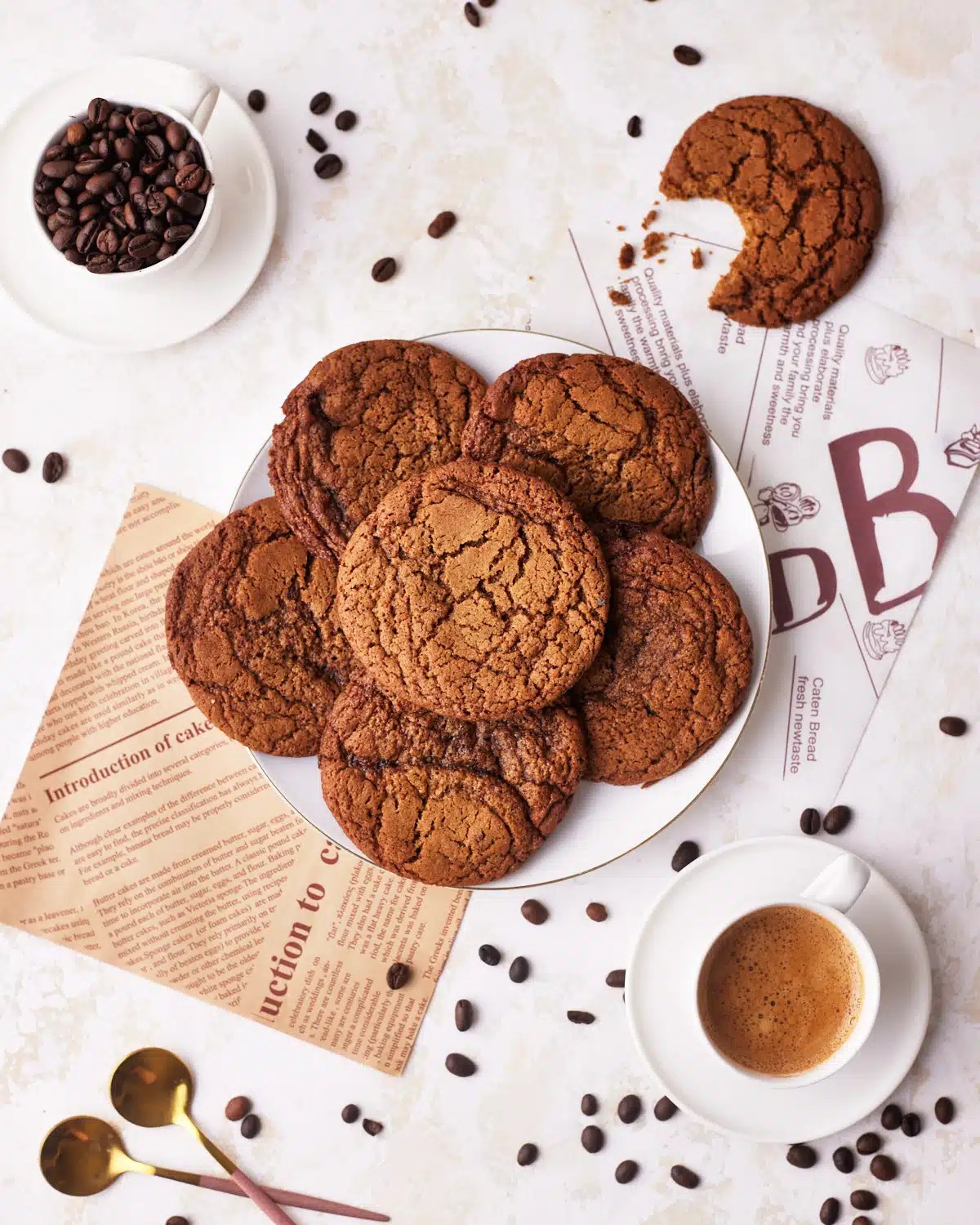 Platter of espresso cocoa cookies with coffee beans and a mug of coffee
