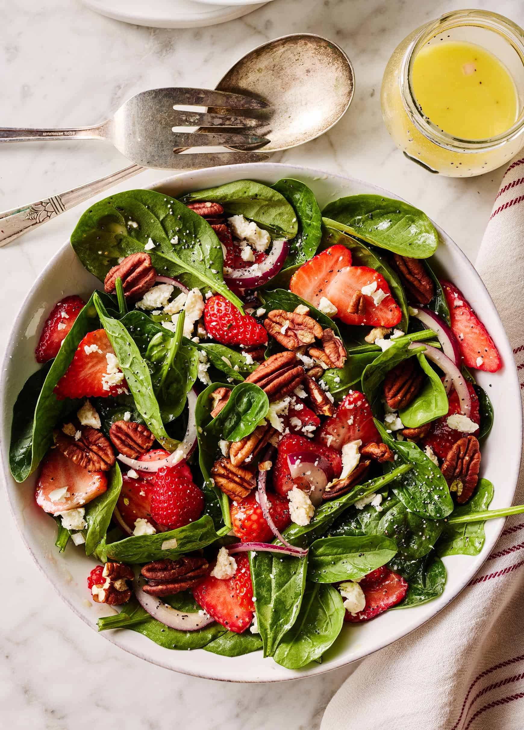 bright and colorful strawberry spinach salad with dijon vinaigrette