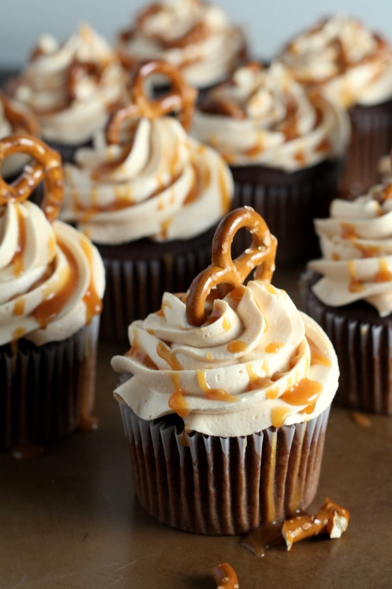 Mini salted caramel pretzel cupcakes on a dessert table