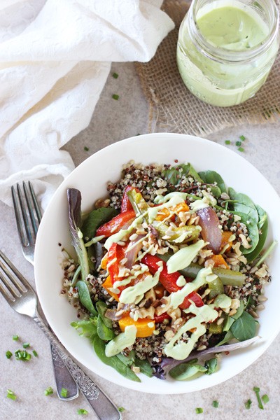 colorful healthy avocado dinner plate with roasted vegetables and quinoa