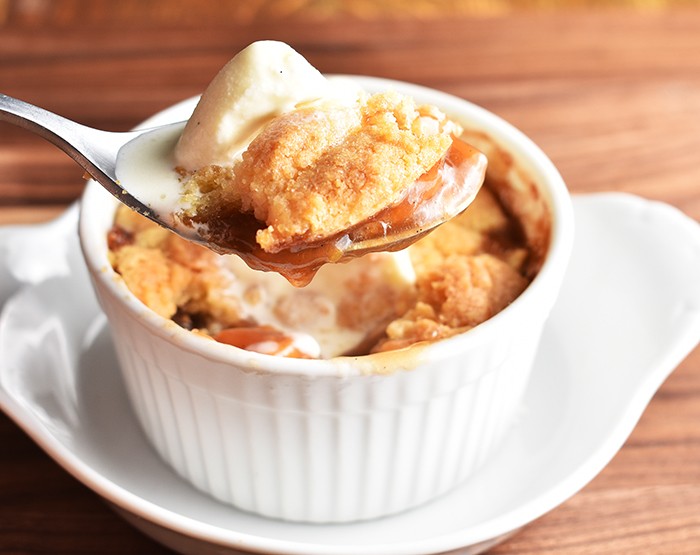 homemade peach cobbler with vanilla ice cream