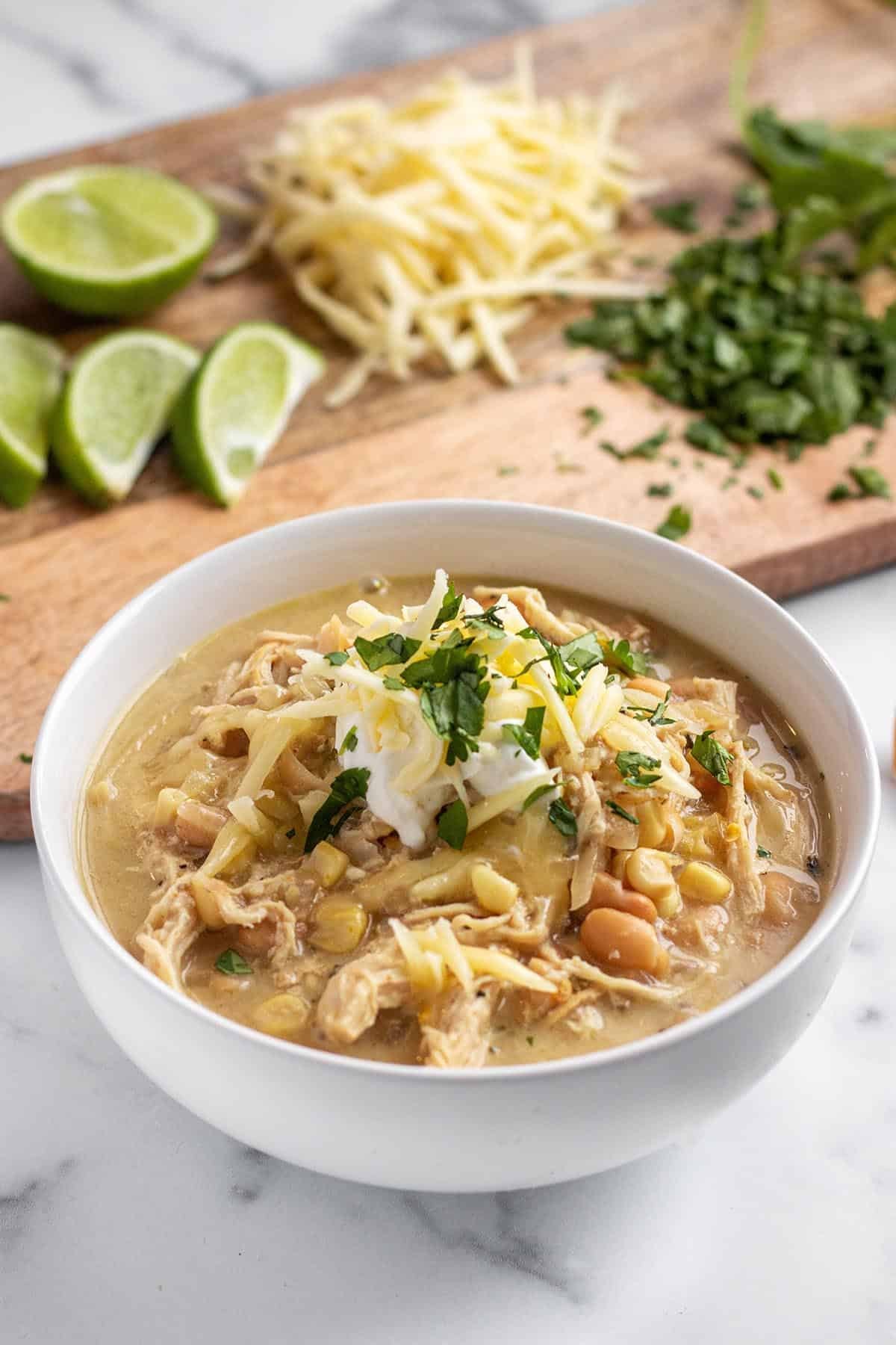 bowl of creamy white chicken chili topped with cilantro