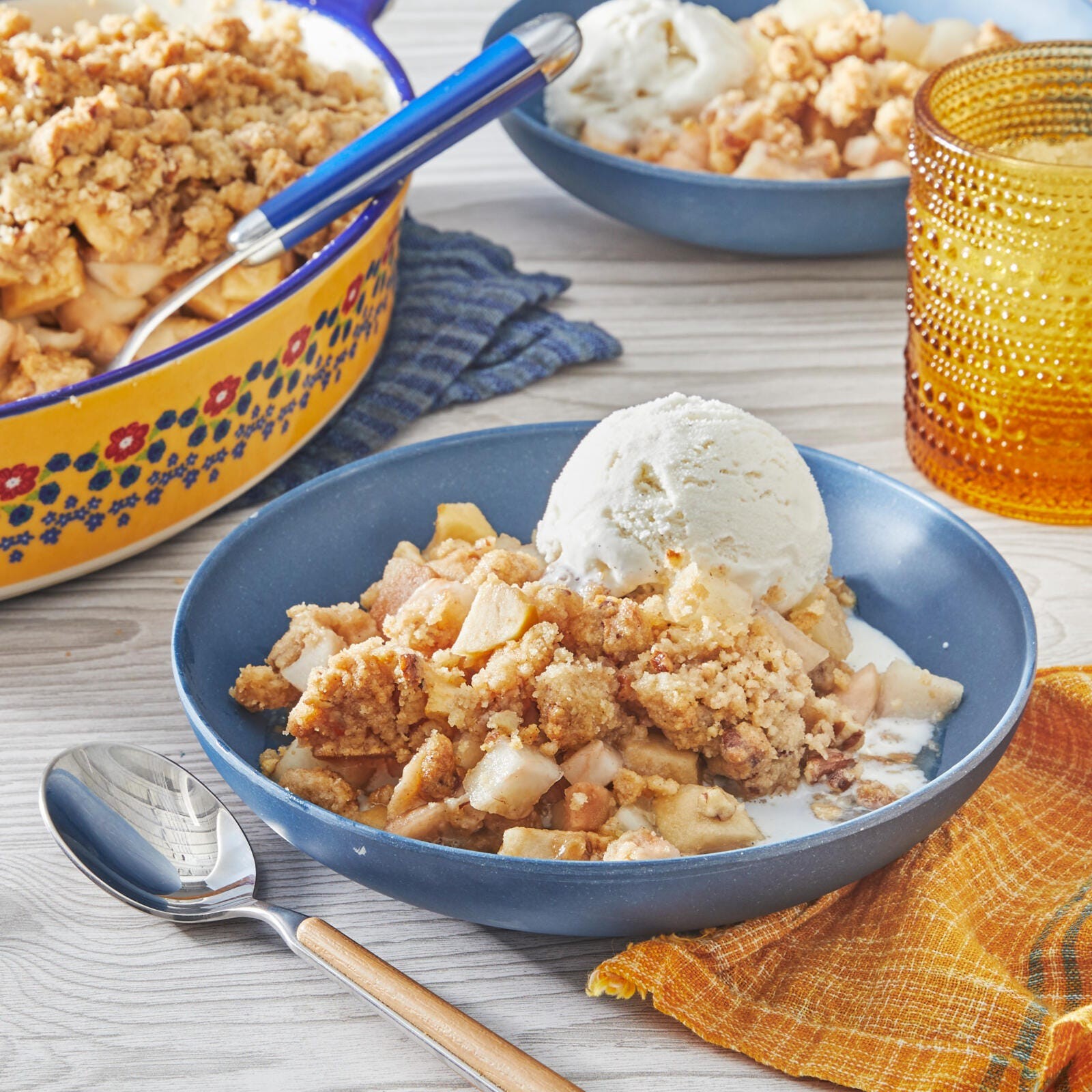 warm pear crisp with vanilla ice cream scoop