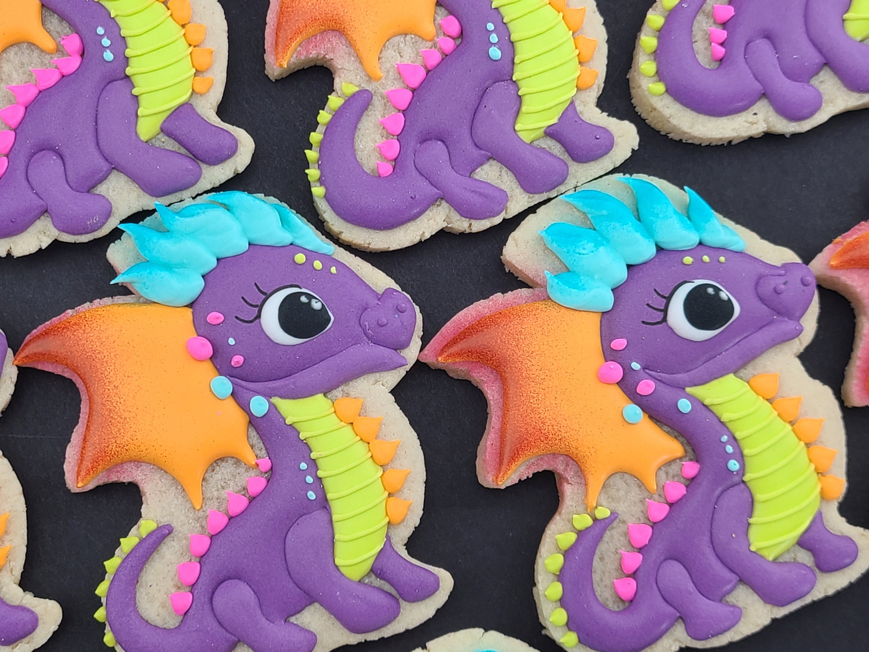 colorful summer dragon cookies decorated with icing