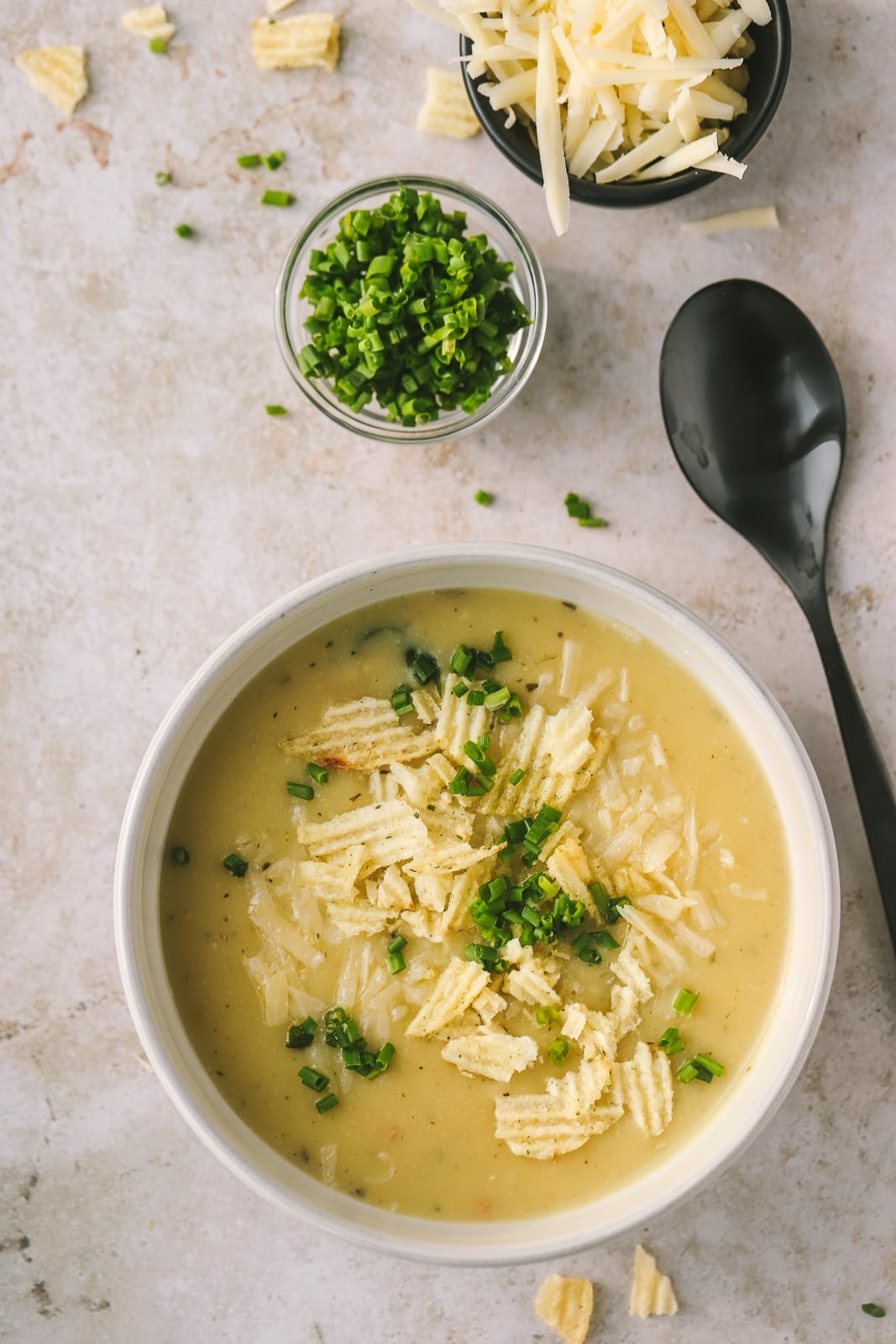 bowl of creamy potato soup with chives
