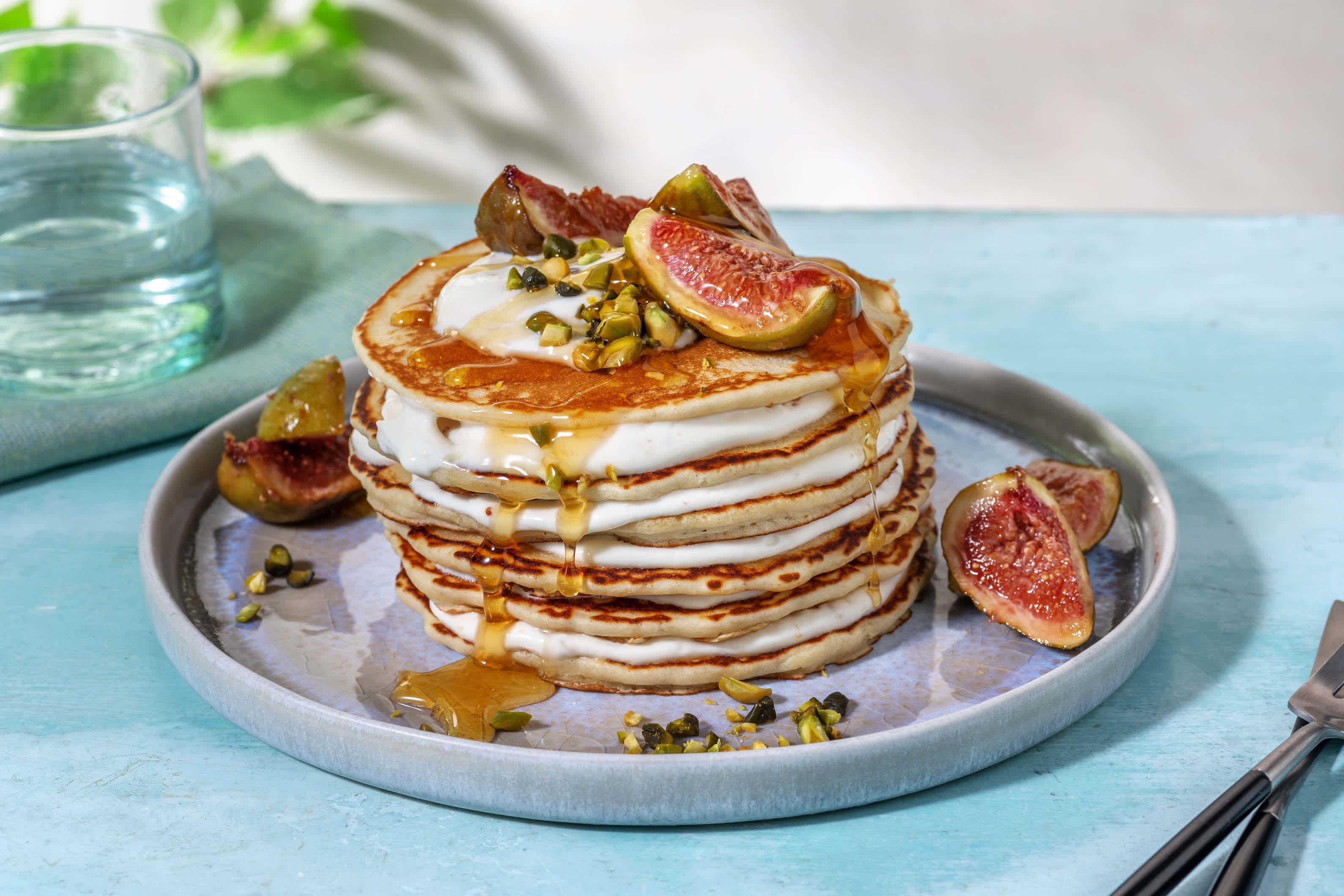 stack of gluten-free fig balsamic pancakes topped with fresh figs and balsamic glaze