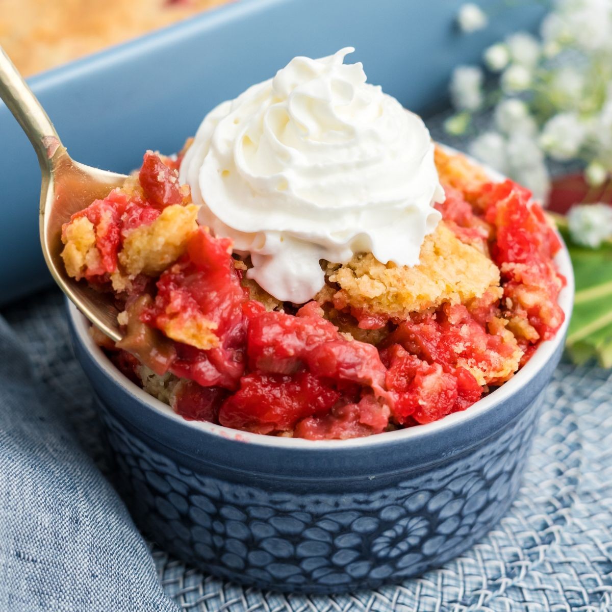 Rhubarb Crepe Dump Cake fresh out of the oven, golden brown and bubbling